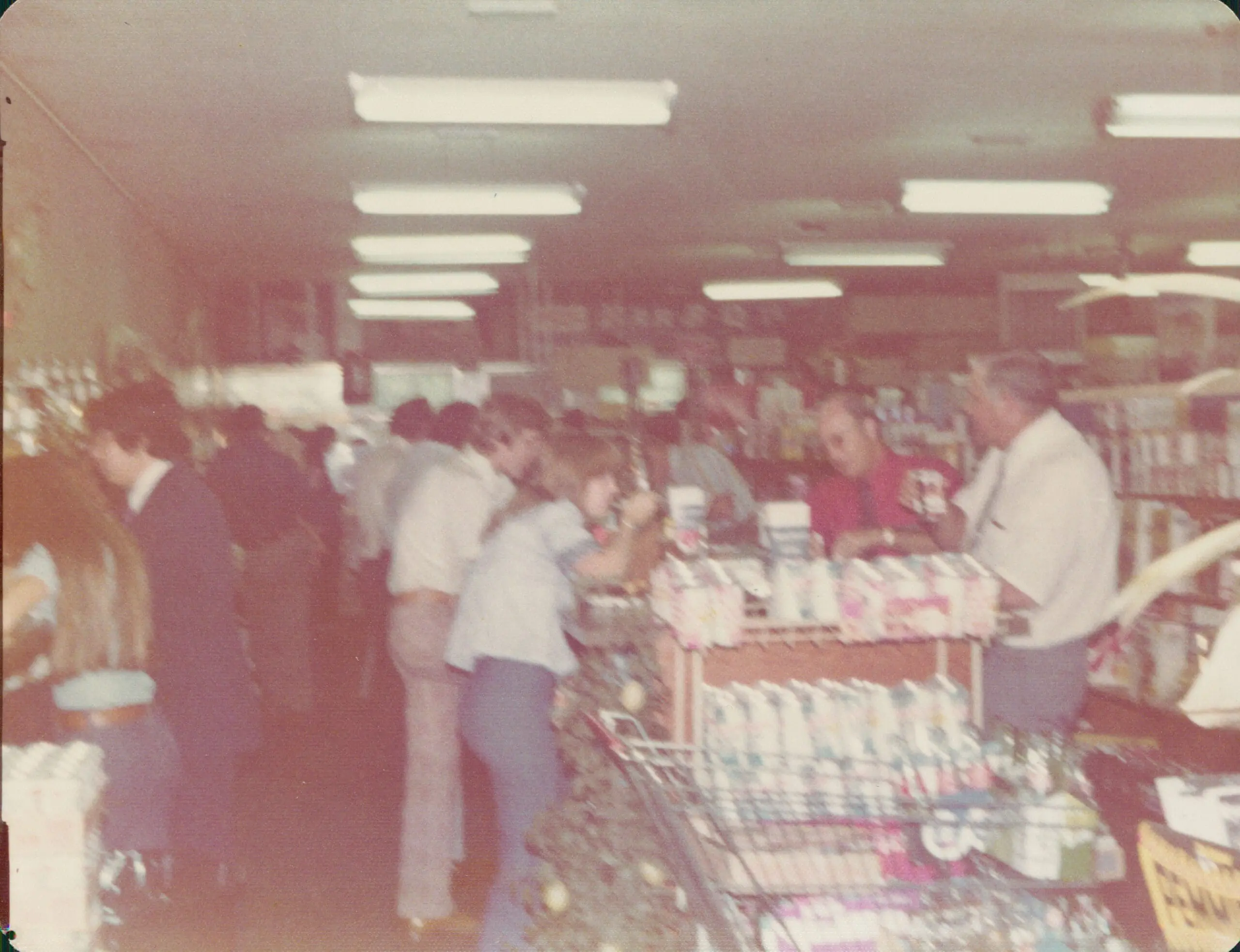 Historic photograph of customers gathered inside Kincaid's grocery store in Fort Worth