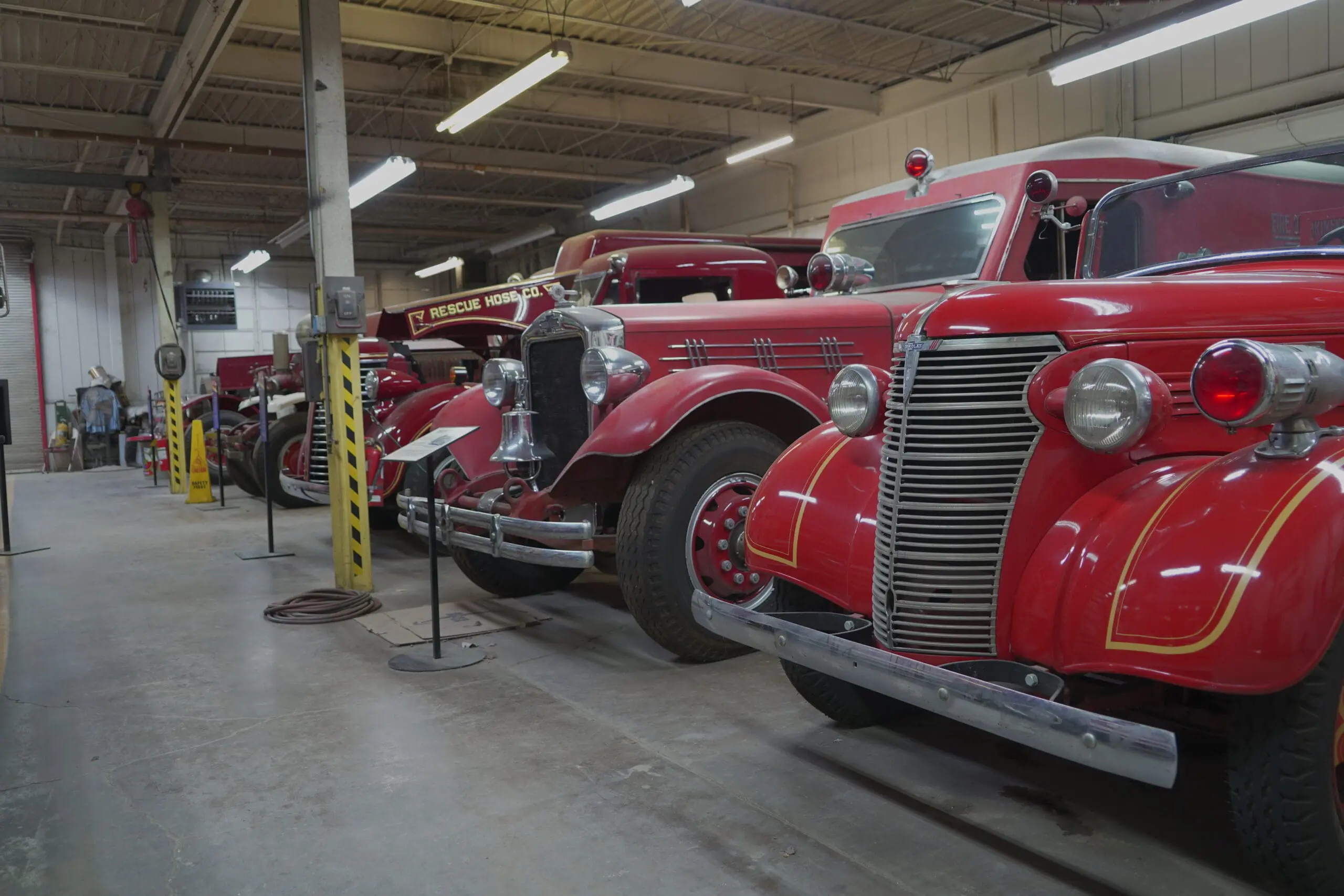Rows of historic fire engines inside the Texas Fire Museum