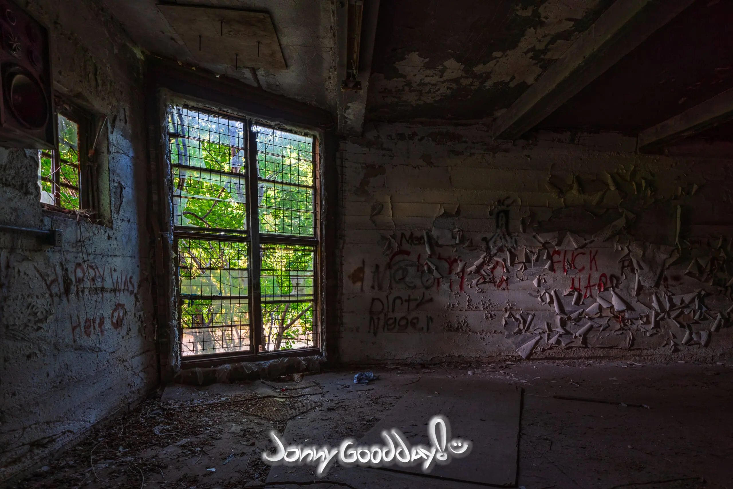 Light enters an abandoned room inside the historic Rhome Mill