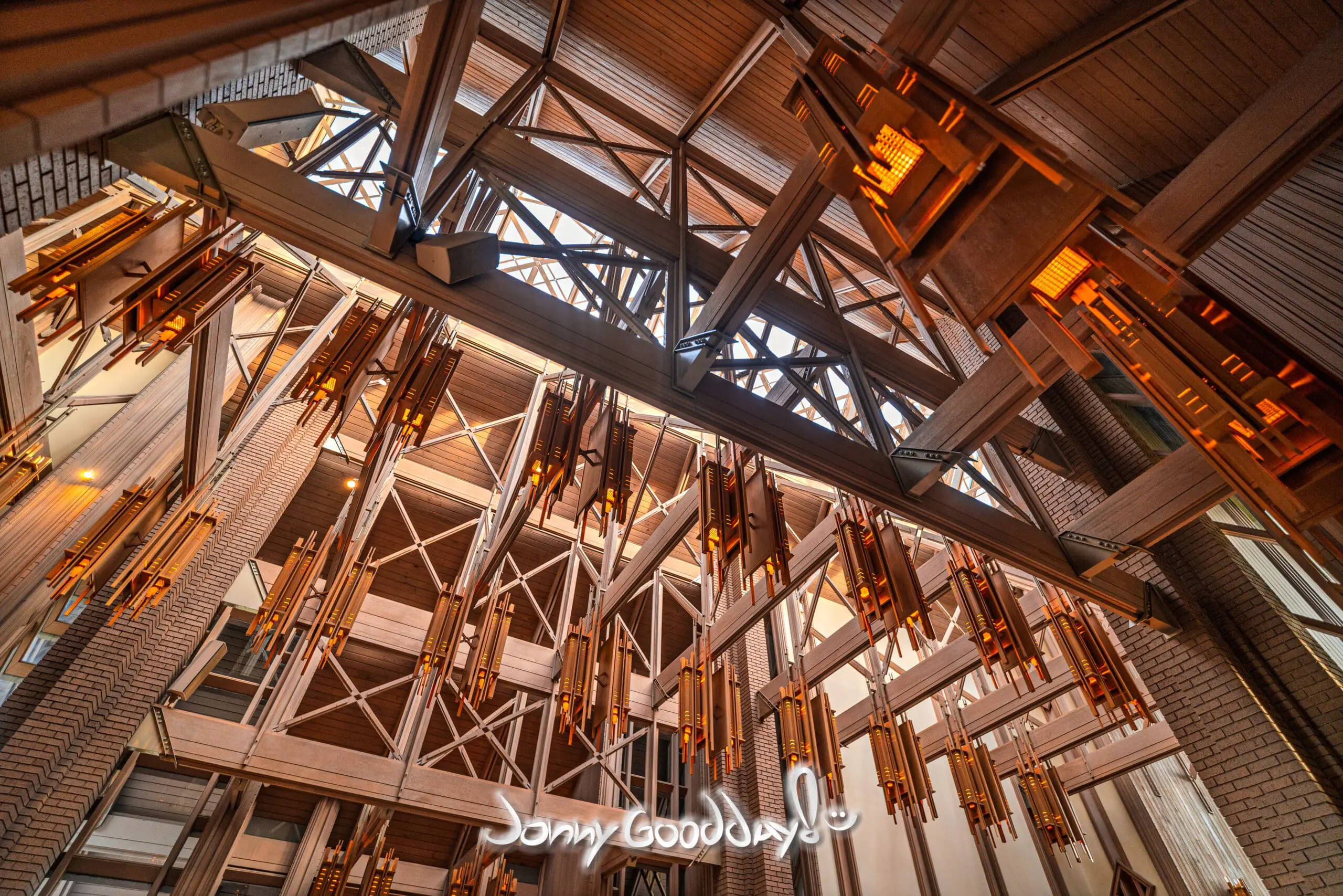 Fay Jones timber trusses, skylights, and glowing suspended lanterns inside Marty Leonard Community Chapel