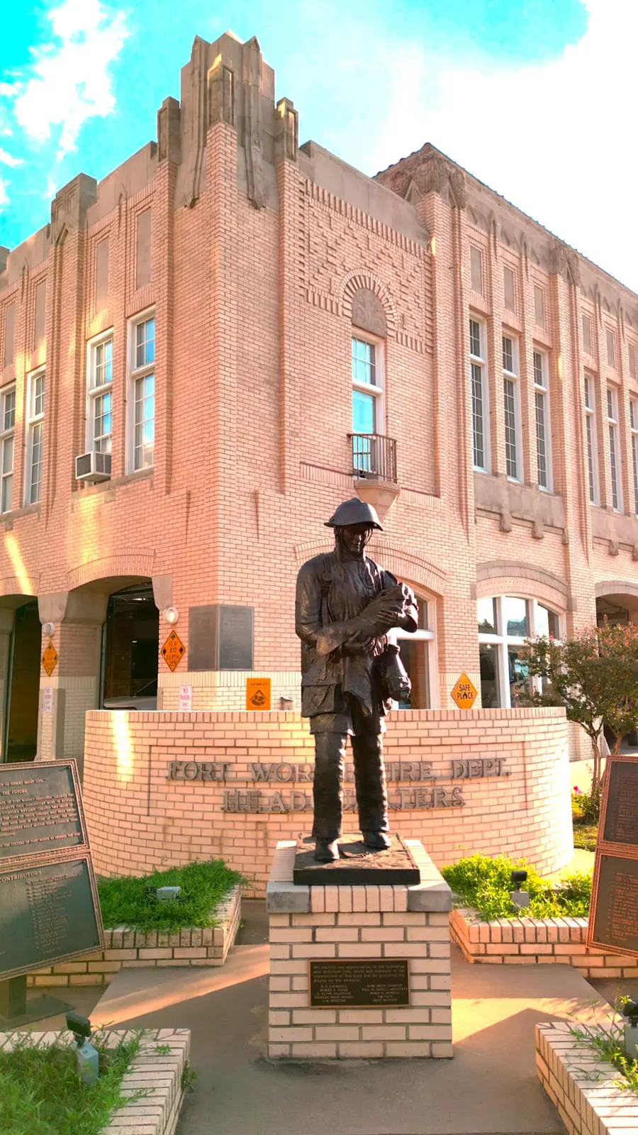 Save the Future statue depicting a firefighter rescuing a child outside Fort Worth Fire Station No. 2
