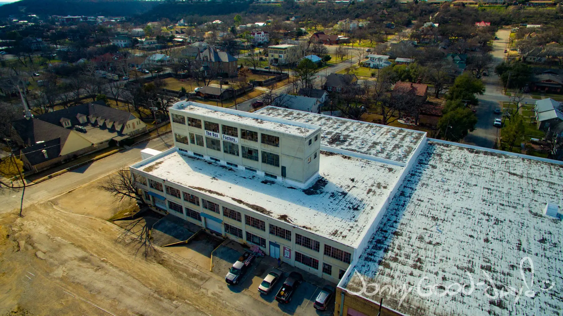 An aerial view of the historic Box Factory building and surrounding neighborhood in Mineral Wells, Texas.