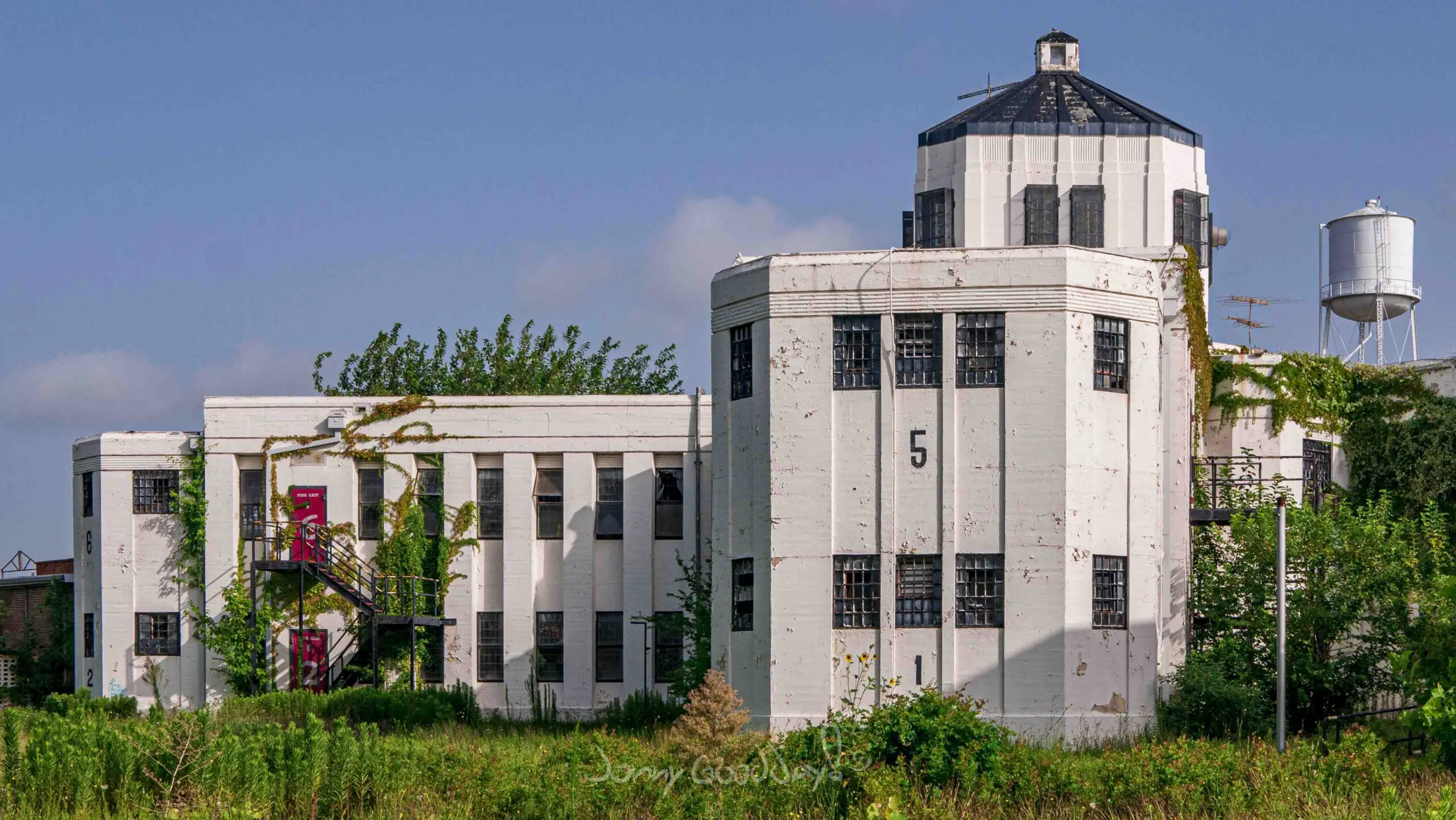 Overgrown Central Unit exterior before demolition, photographed by Jonny Goodday in 2018.