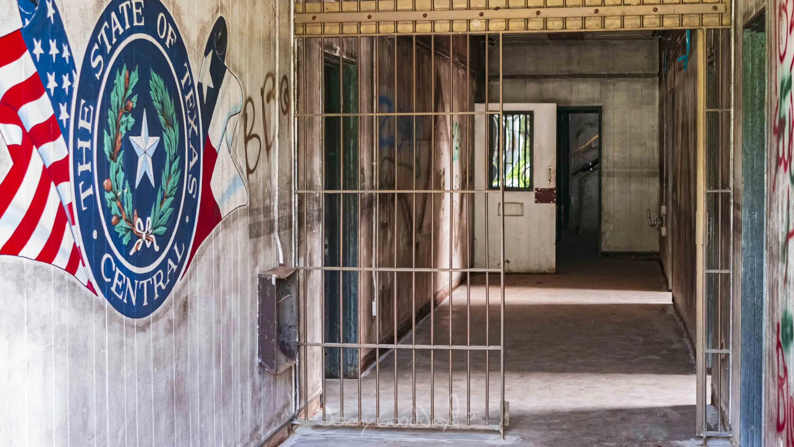 Central Unit interior corridor with Texas Department of Corrections mural, photographed by Jonny Goodday in 2018.