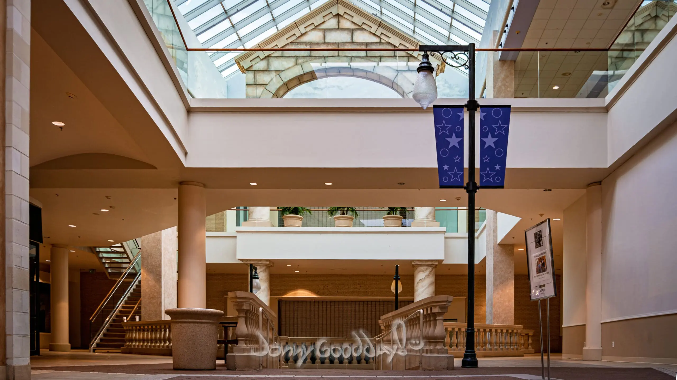 Empty skylit atrium inside Ridgmar Mall