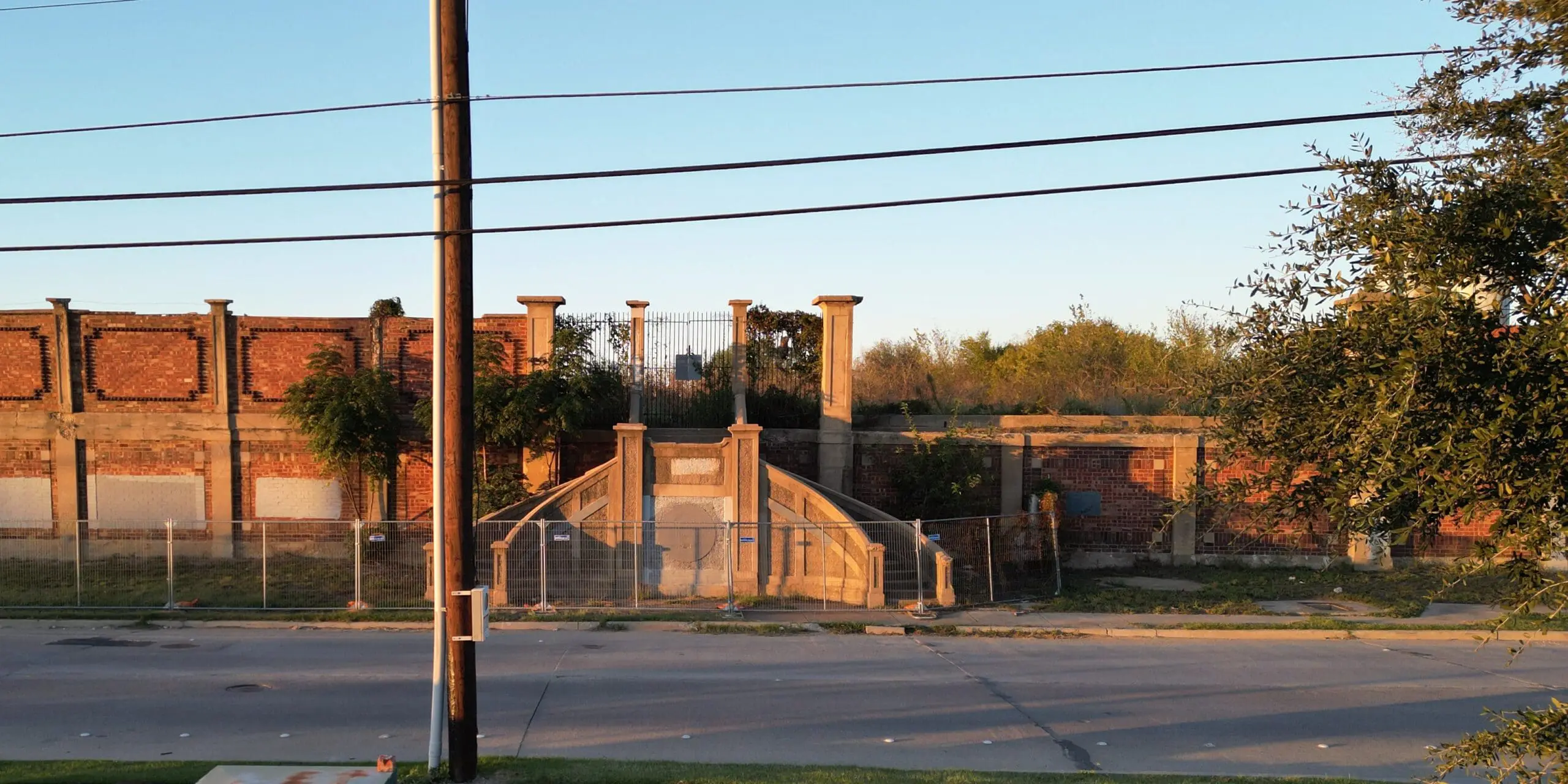 The surviving Swift & Company employee staircase and Victorian-era brick wall along Northeast 23rd Street in Fort Worth.