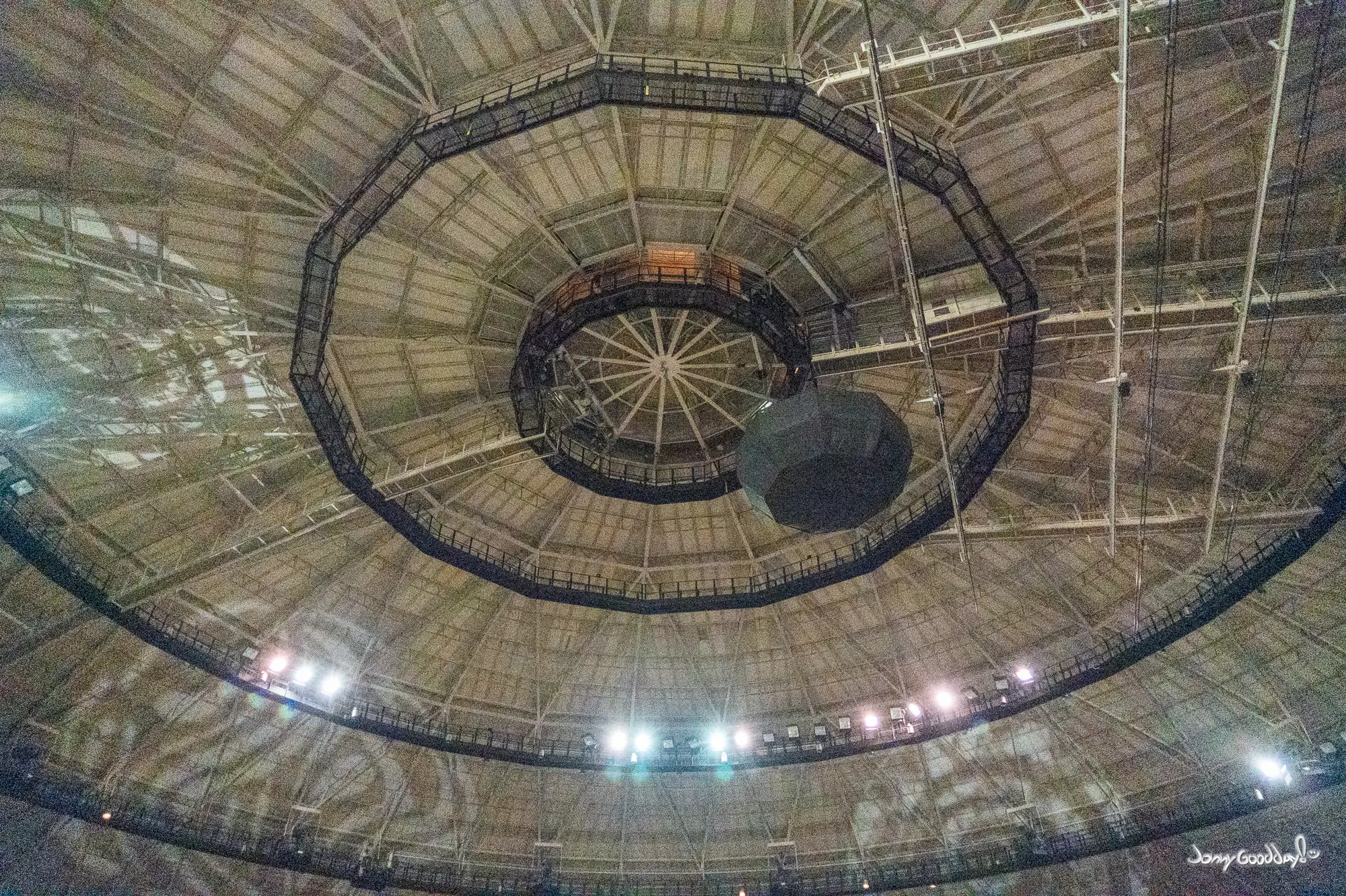 Concentric catwalks and exposed steel structure beneath the Fort Worth Convention Center Arena dome