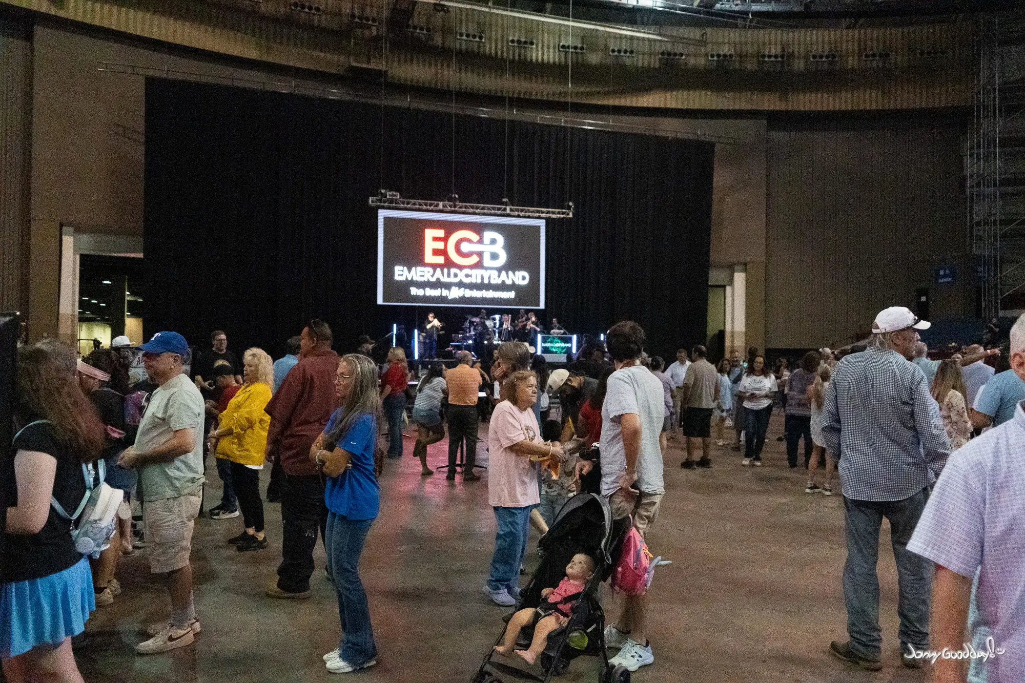Visitors gathered on the arena floor in front of the Emerald City Band stage at the farewell event