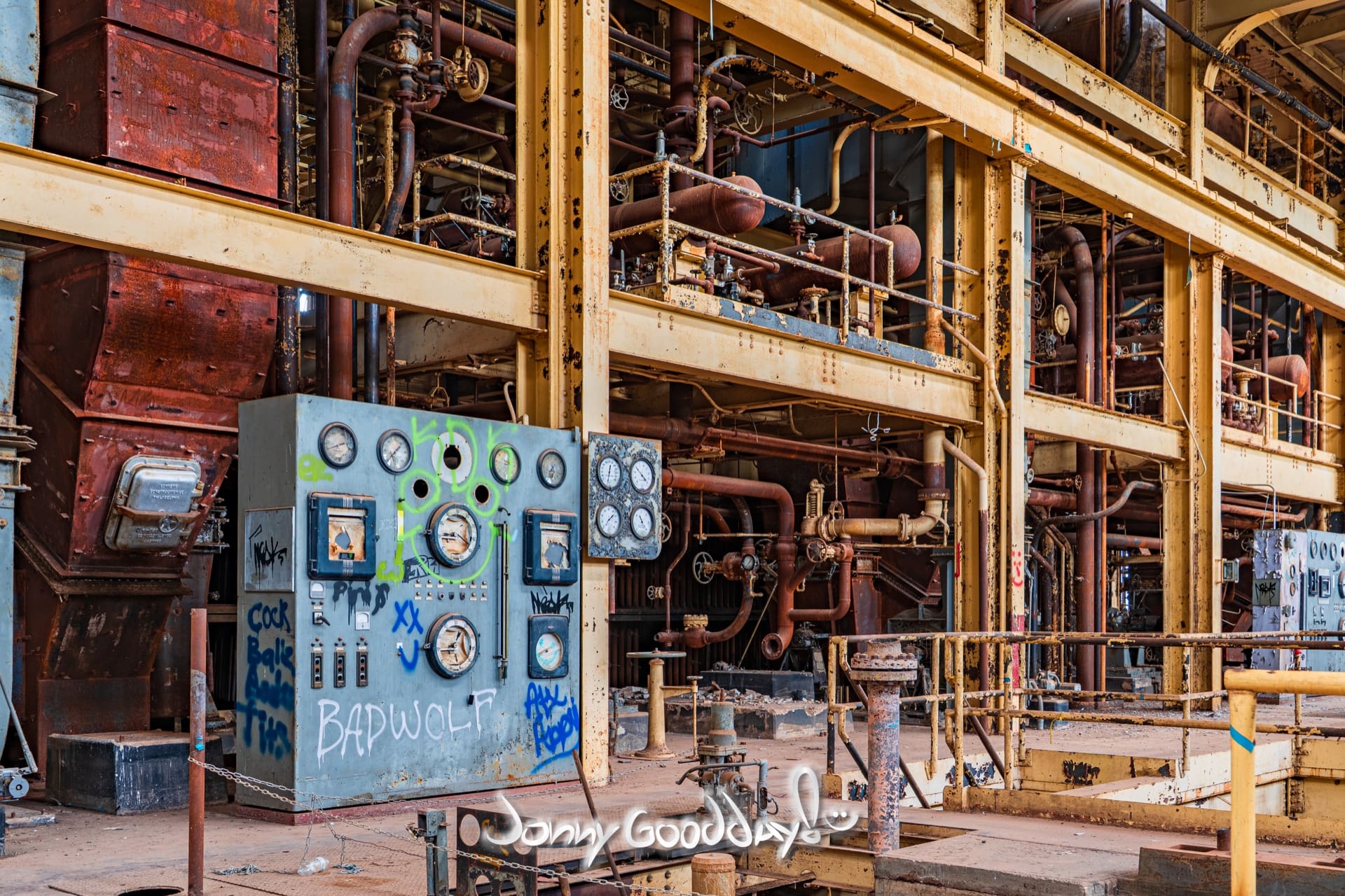 Empty WTU power plant interior with weathered gauges, rusted pipes and steel beams
